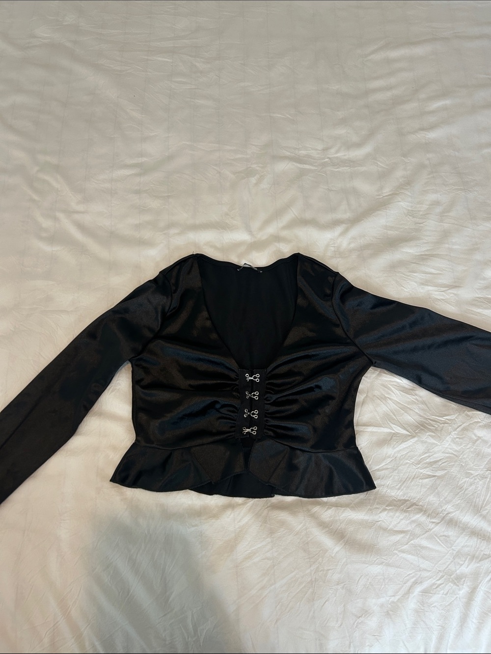 Black Satin Long-Sleeve Corset Front Peplum Top from fashion nova